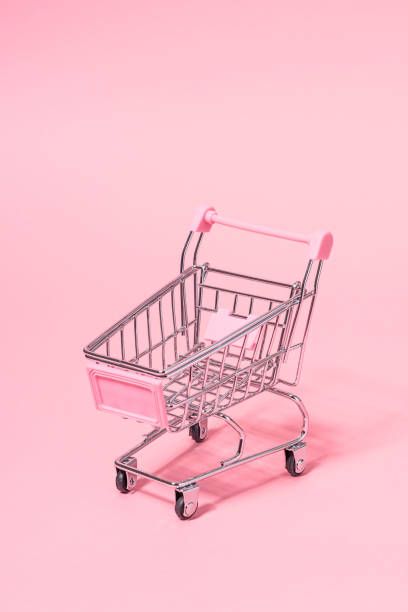 Metallic Small Toy Shopping Cart on Pink Background.
